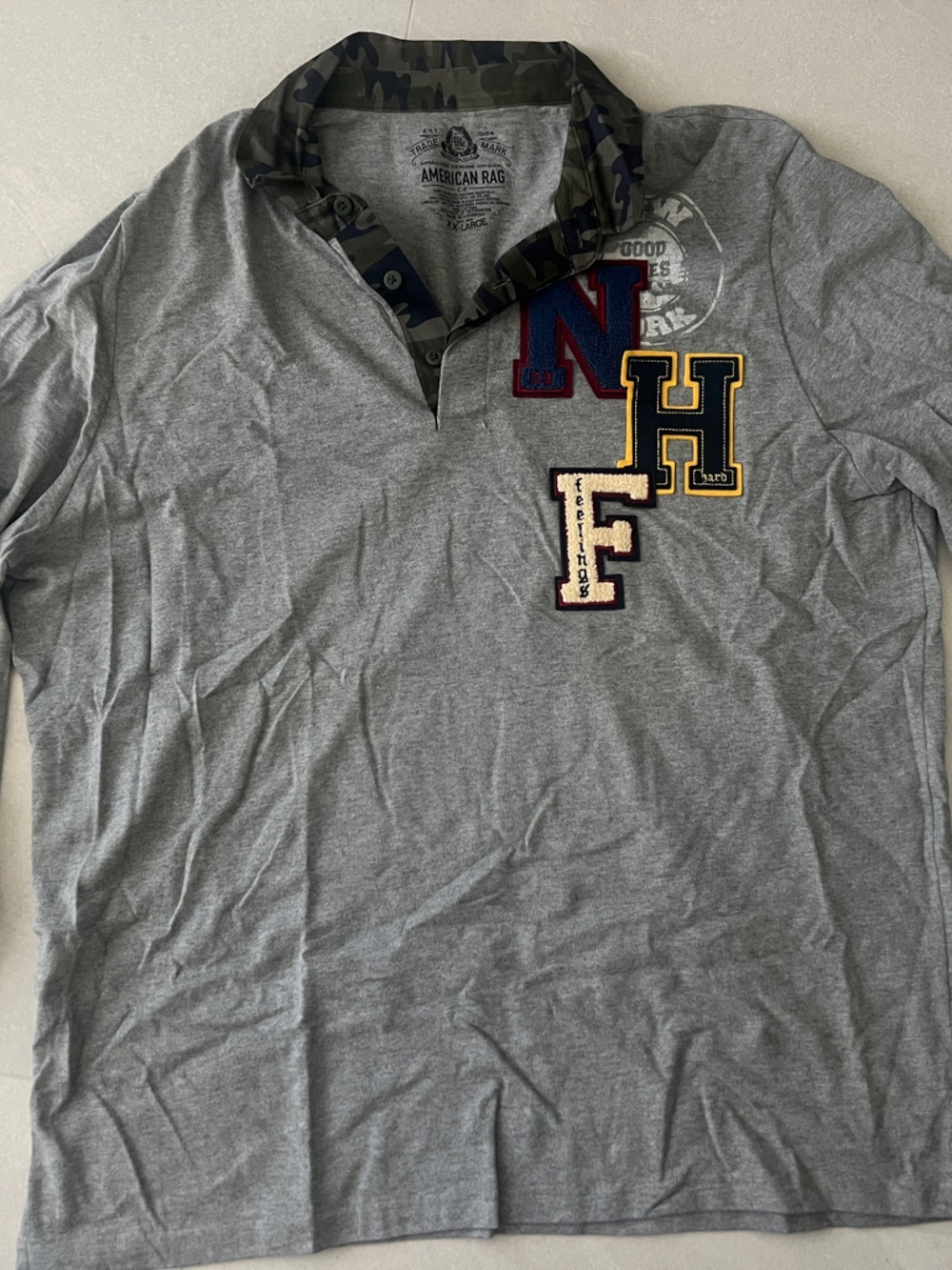 American Rag Heather Gray Polo with Navy, Red, and Yellow Patches